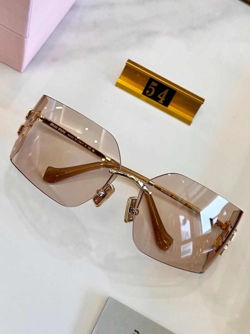 Miu Miu Rimless Sunglasses with Pink-Brown Lenses and Gold Accents - Picture 2 of 8